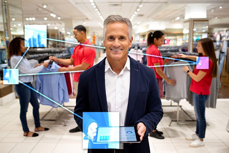Retail store owner overseeing operations with TVI 1 Retail store owner overseeing his staff, customers and inventory with TVI