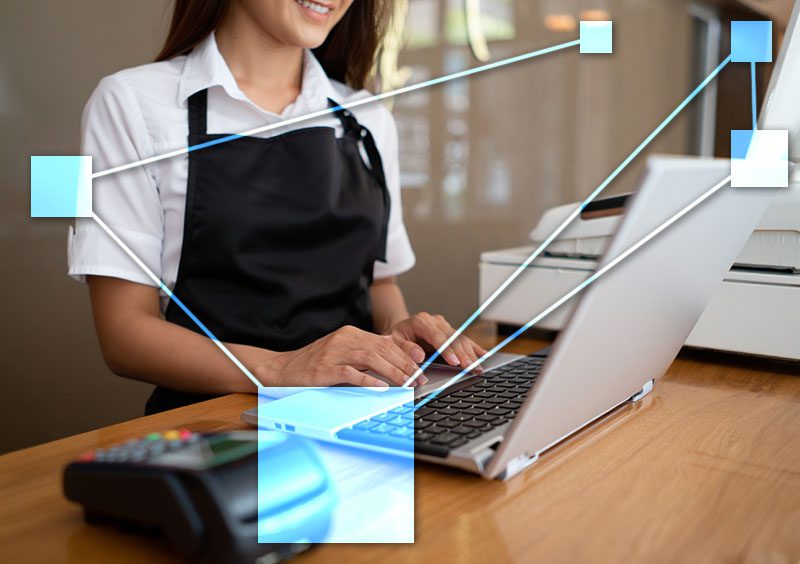 Salon clerk using TVI business management TVI POS (Point Of Sale) connected Inventory, CRM, and Accounting in real-time.